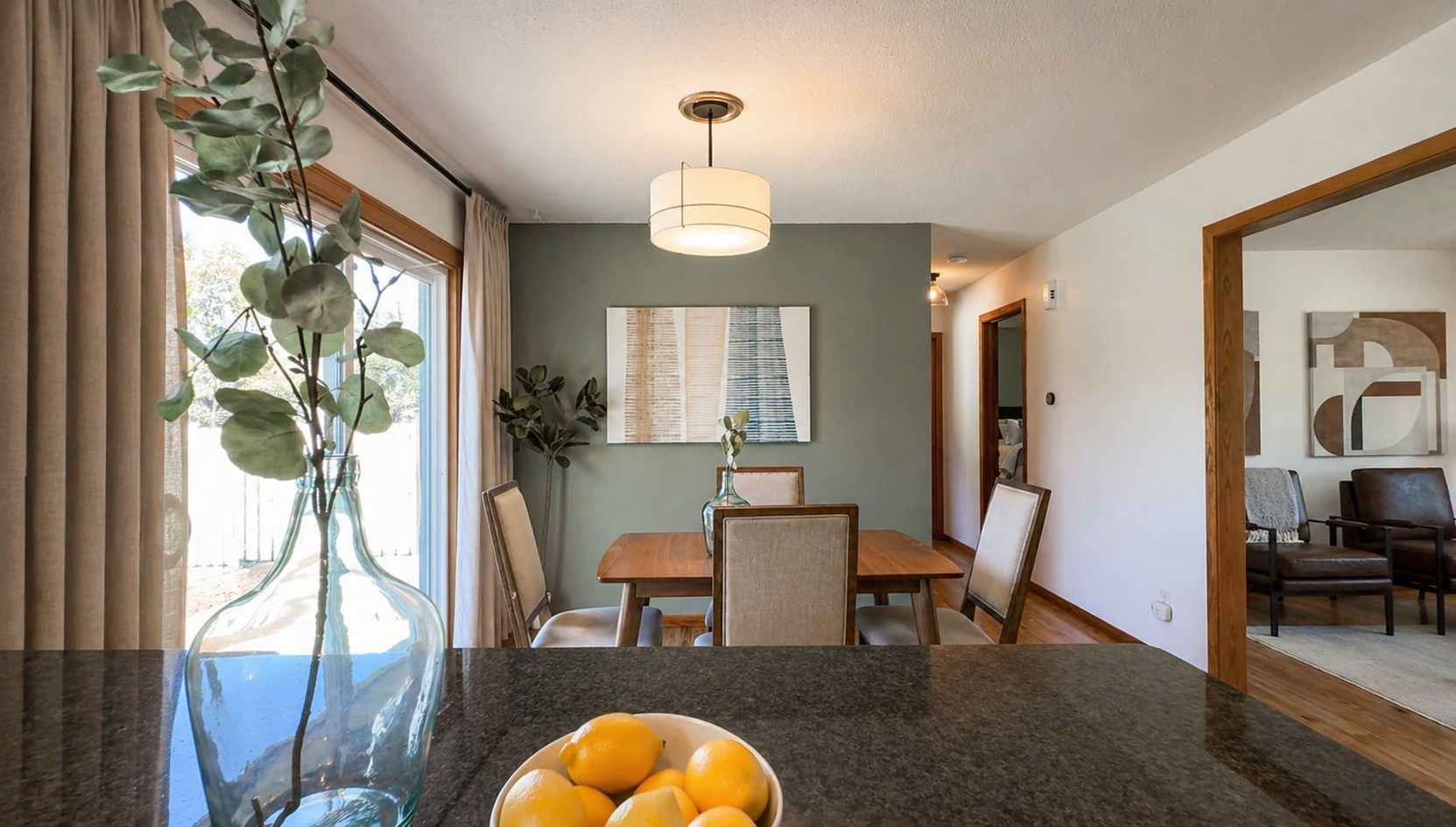 Positioned between the living room and kitchen, this space becomes the heart of the home—ideal for gathering, hosting, and staying connected. Thoughtful updates and cohesive finishes create a flow that feels both functional and elevated.