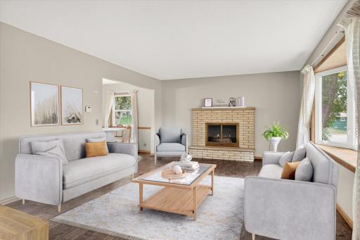 Photo for 8949 Rosewood Lane N, Maple Grove, MN 55369 - listing #6814677 Sun-filled living room with a cozy fireplace—perfect for relaxing or entertaining!