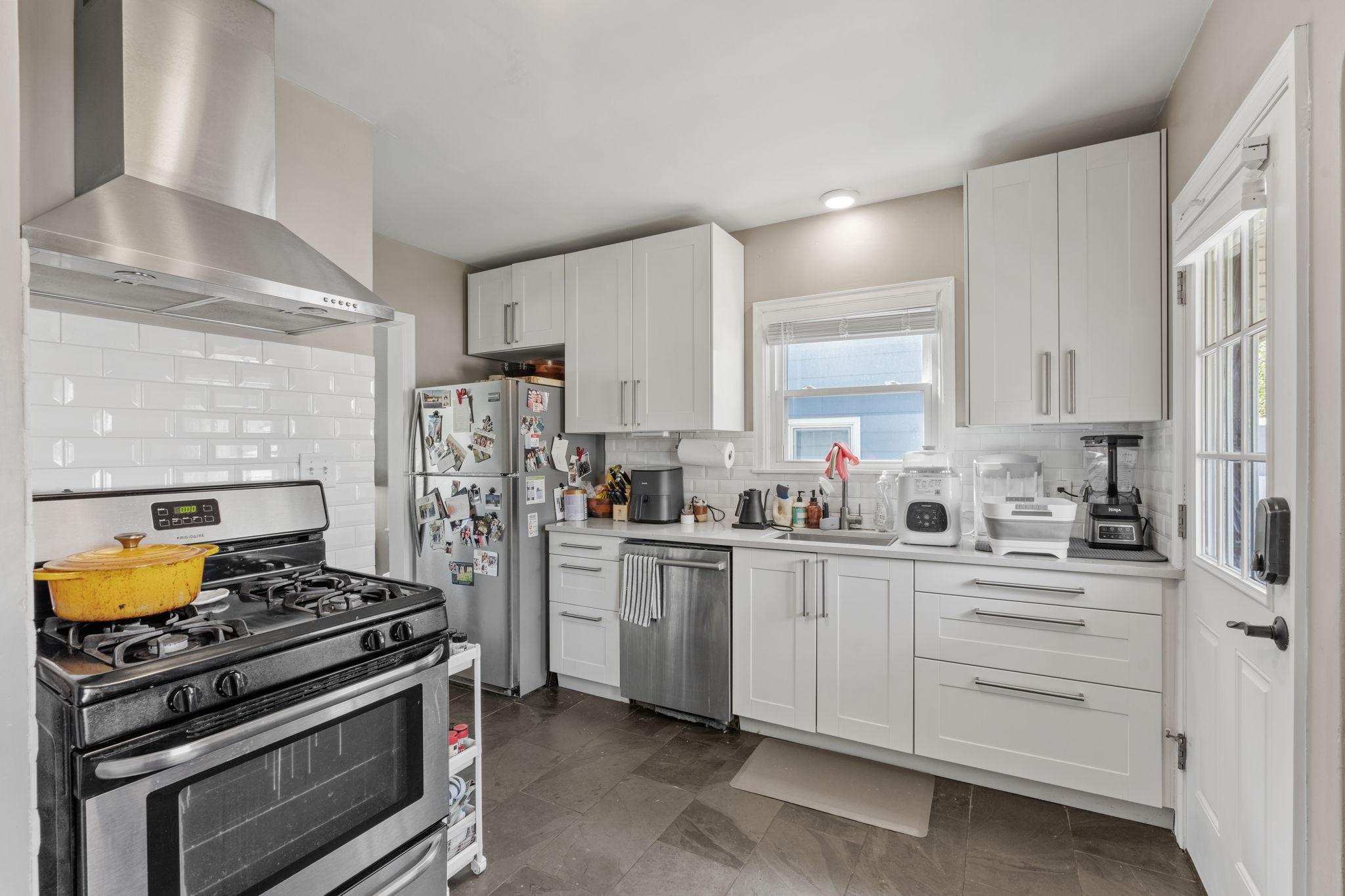 New cabinets, backsplash and stainless steel appliances!