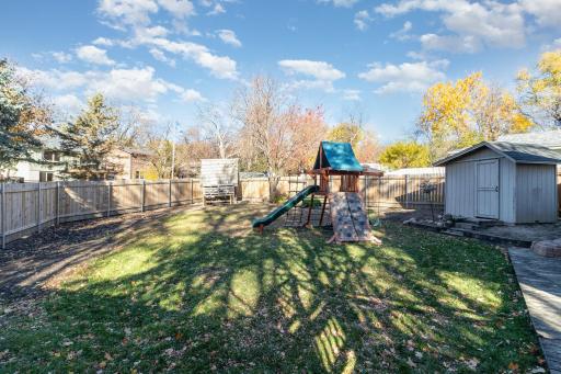 Fully fenced back yard with a play set that can stay with the home. The backyard faces West for beautiful sunsets.