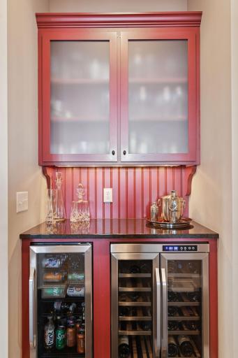 The main floor wet bar boasts a beverage and wine cooler