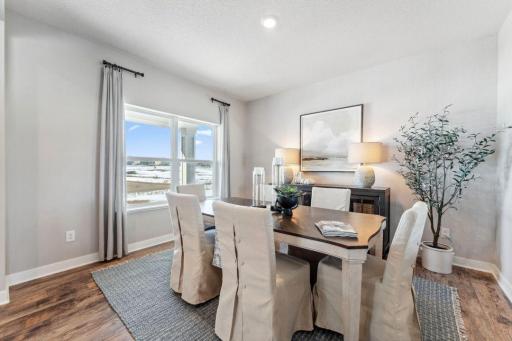 The front flex room is suited for formal dining, a second gathering area, or playroom. You decide! Photo of model home, colors and finishes are similar.
