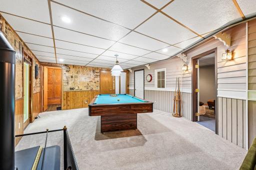 Recreation Room with Back of Home Access Door and 1/2 Bath