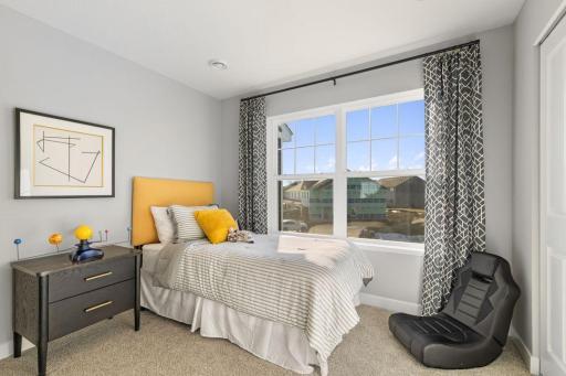 Each of the home's spacious secondary bedrooms feature well thought out window locations. Photo is of model home. Colors and options may vary. Ask Sales Agent for details.