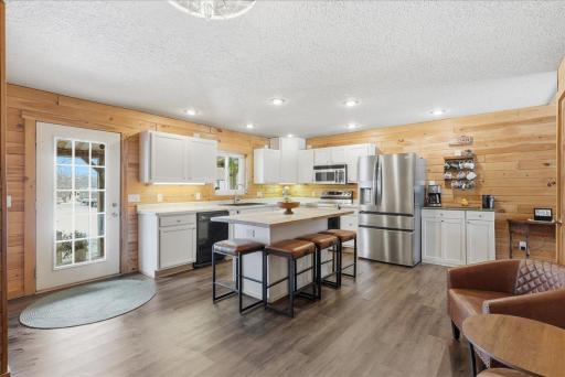 Bright, west-facing kitchen that immediately welcomes you through the front door
