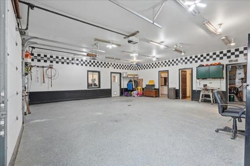 Large, heated garage/shop with utility room, laundry and bathroom. Could easily be livable space