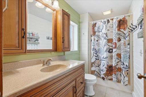 Primary ensuite with new vanity and additional storage spaces added