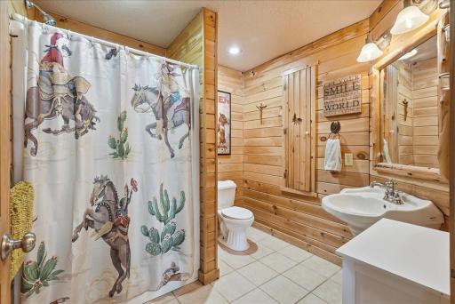 Large bathroom located near bedrooms and office