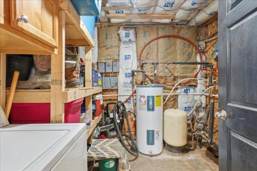 Utility room with laundry in heated garage/shop