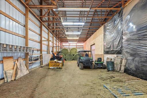 Cold storage area and covered pass-through from stall barn to indoor arena. Great for hay storage, equipment and more