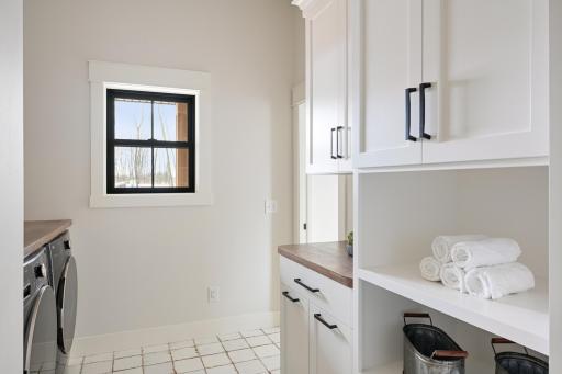 Main Level Laundry -Images shown are from previous model and representative of design, layout and finishes