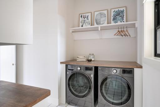 Main Level Laundry -Images shown are from previous model and representative of design, layout and finishes