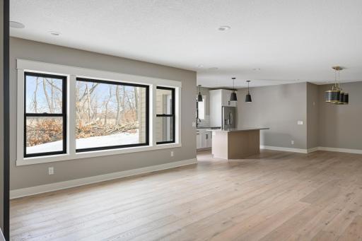 Lower Level Family Room - Images shown are from previous model and representative of design, layout and finishes