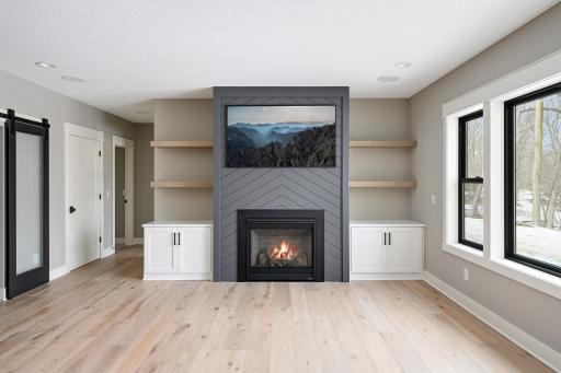Lower Level Family Room - Images shown are from previous model and representative of design, layout and finishes