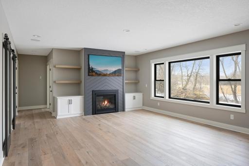 Lower Level Family Room - Images shown are from previous model and representative of design, layout and finishes