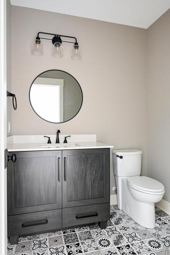 Lower Level 1/2 Bath - Images shown are from previous model and representative of design, layout and finishes