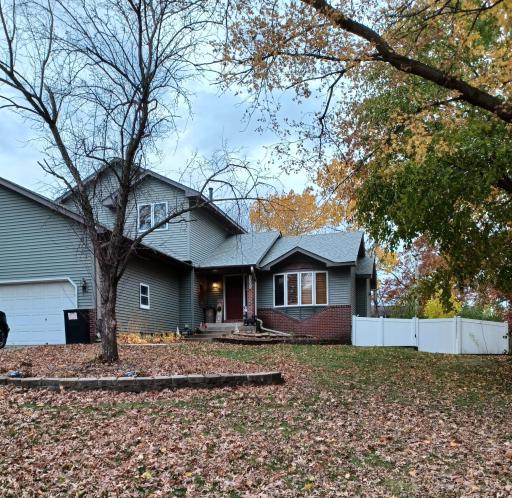 Photo for 2065 Kings Road, Saint Paul, MN 55122 - listing #6815958 A welcoming front door and porch create an inviting first impression with warm lighting, simple décor, and charming architectural details.