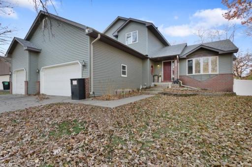 Photo for 2065 Kings Road, Saint Paul, MN 55122 - listing #6815958 A welcoming front door and porch create an inviting first impression with warm lighting, simple décor, and charming architectural details.