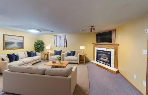 (Virtually Staged) Walkout Basement Family Room w/ Gas Fireplace