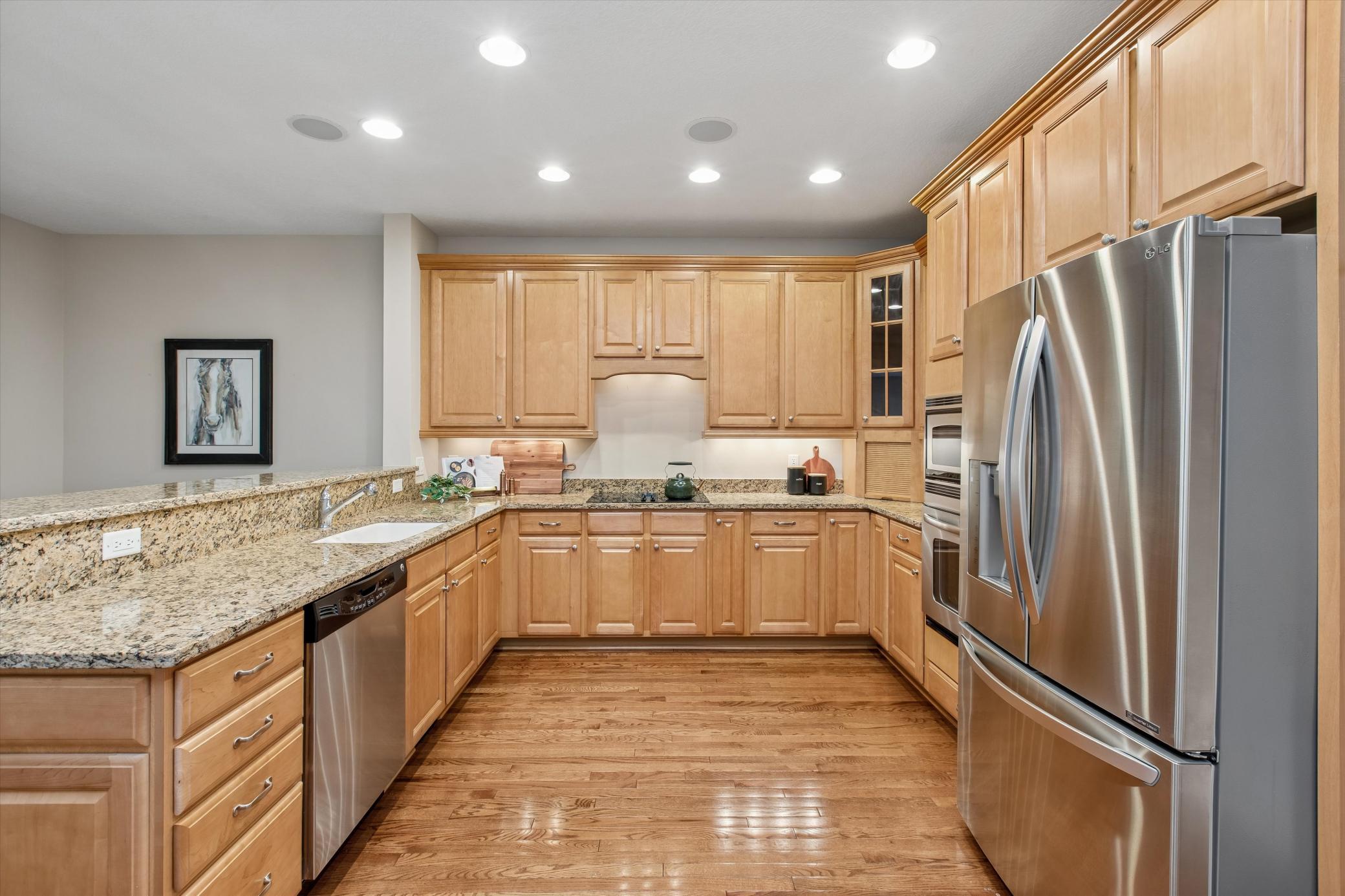 Big, open kitchen featuring stainless steel appliances