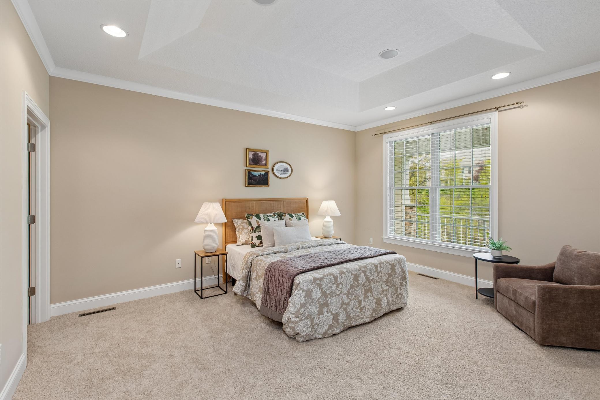 Primary bedroom with pond views