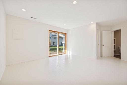 Spacious walk-out lower level with access to the backyard - perfect for a second living area, home office or gym.