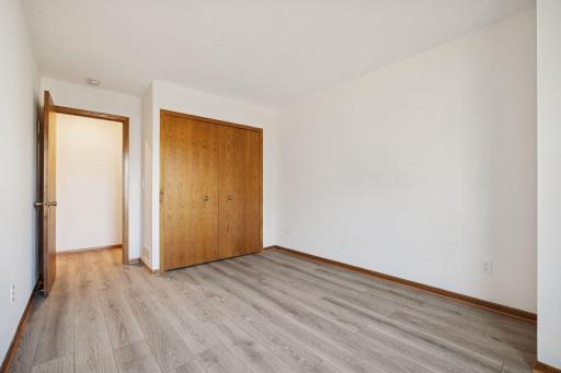 Comfortable layout with a double-door closet and warm natural light.