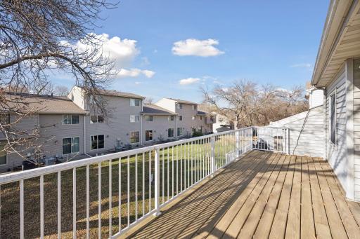 Spacious deck provides the perfect spot for morning coffee or evening relaxation with scenic neighborhood views.