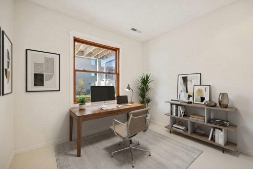 Cozy lower-level 3rd bedroom with a full-size window and fresh paint - ideal for a home office, guest space or hobby room. Virtually staged.