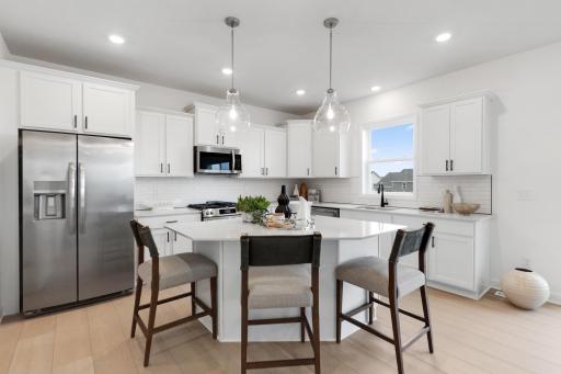 (Photo of model home, features may vary) The kitchen naturally operates as the heart of this home, offering ample countertop space and brand-new appliances that will inspire attempts at new recipes.