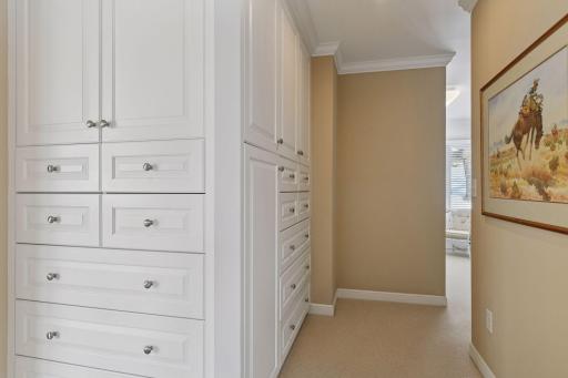 Built-in cabinets and drawers are part of the walk-in closet addition.