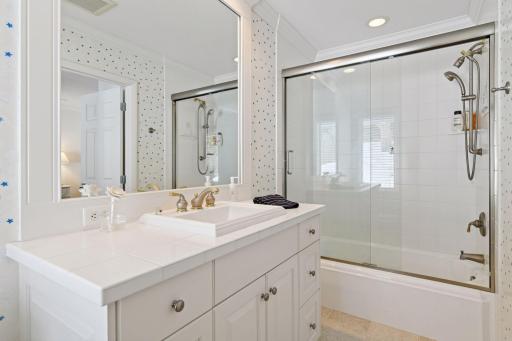 Attached, updated full bathroom and comfort-height vanity.
