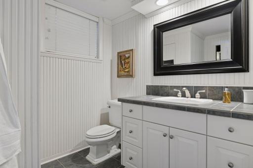 The walk-out level bathroom was updated with new tile, a walk-in shower and a comfort-height countertop.