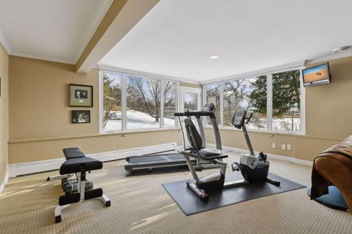 This level walks out to the private, wooded 1.4 acre lot.