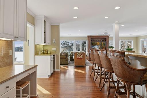 This open space includes the kitchen, a planning desk, family room and informal dining.