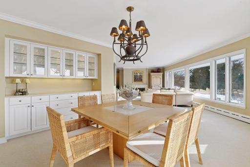 Custom built-in cabinetry and drawers beautifully store glassware and dishes, complemented by a buffet ideal for effortless entertaining.