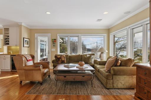 Cozy family room with a built in TV hutch and a door that opens to the deck.