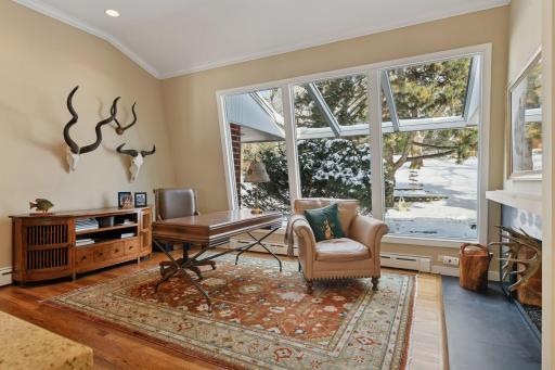 Large office with a curved glass window. Watch the seasons change!