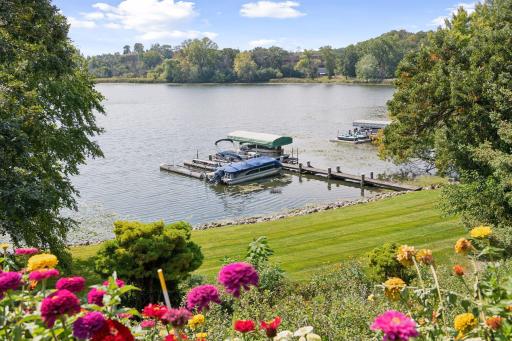 It won't be long! Imagine this view of Bryant Lake from your deck. Permanent dock, deeded access and 154 feet of lakeshore.