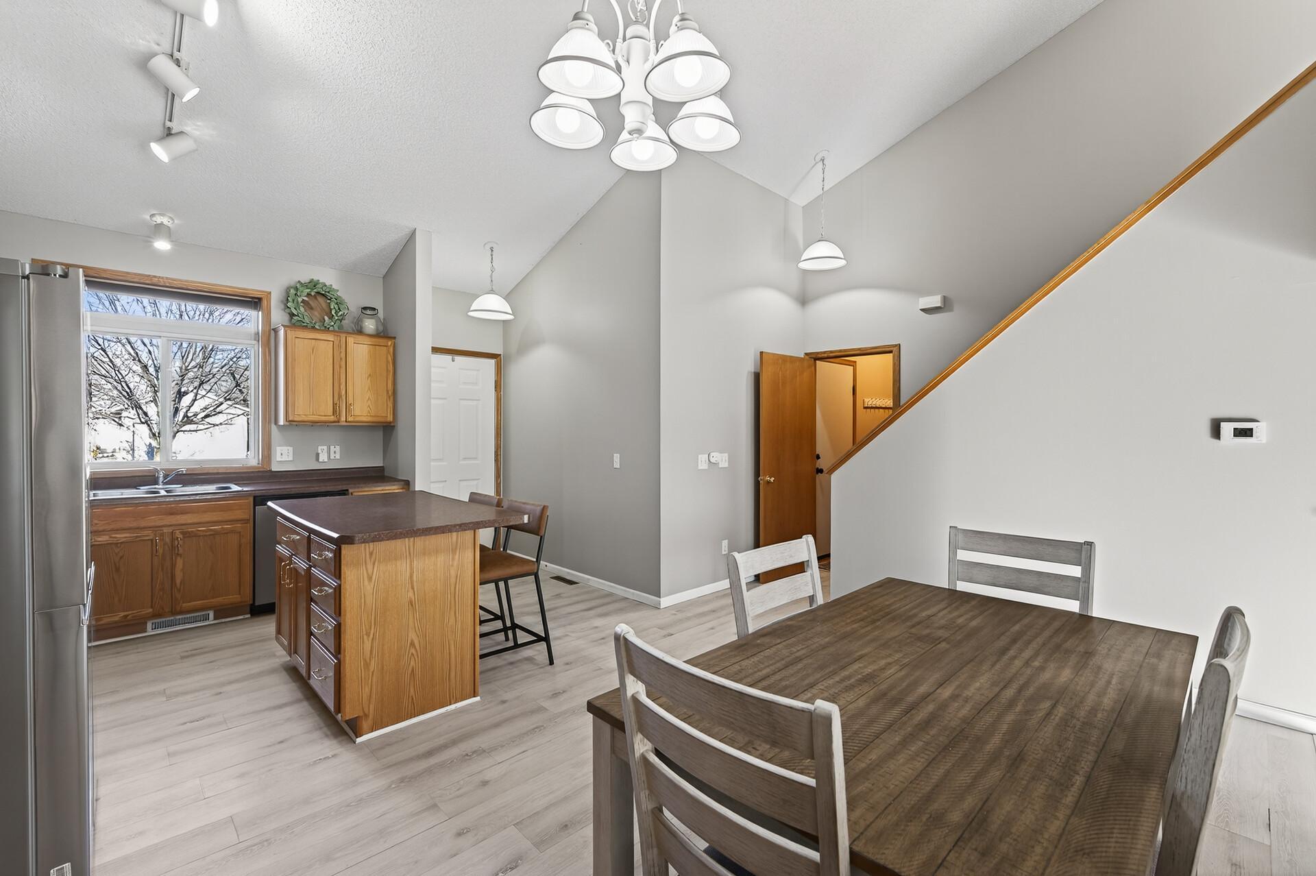Open-concept kitchen overlooks the dining area and living room, creating an easy flow for everyday living and entertaining.