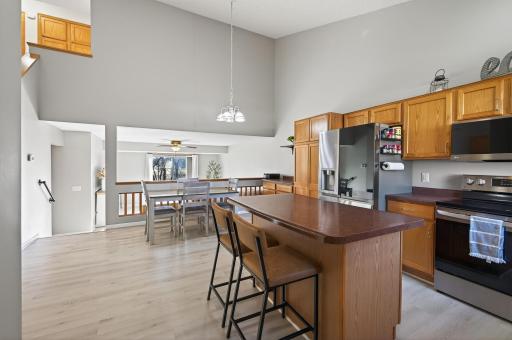 Functional center island offers additional prep space, storage, and casual seating.
