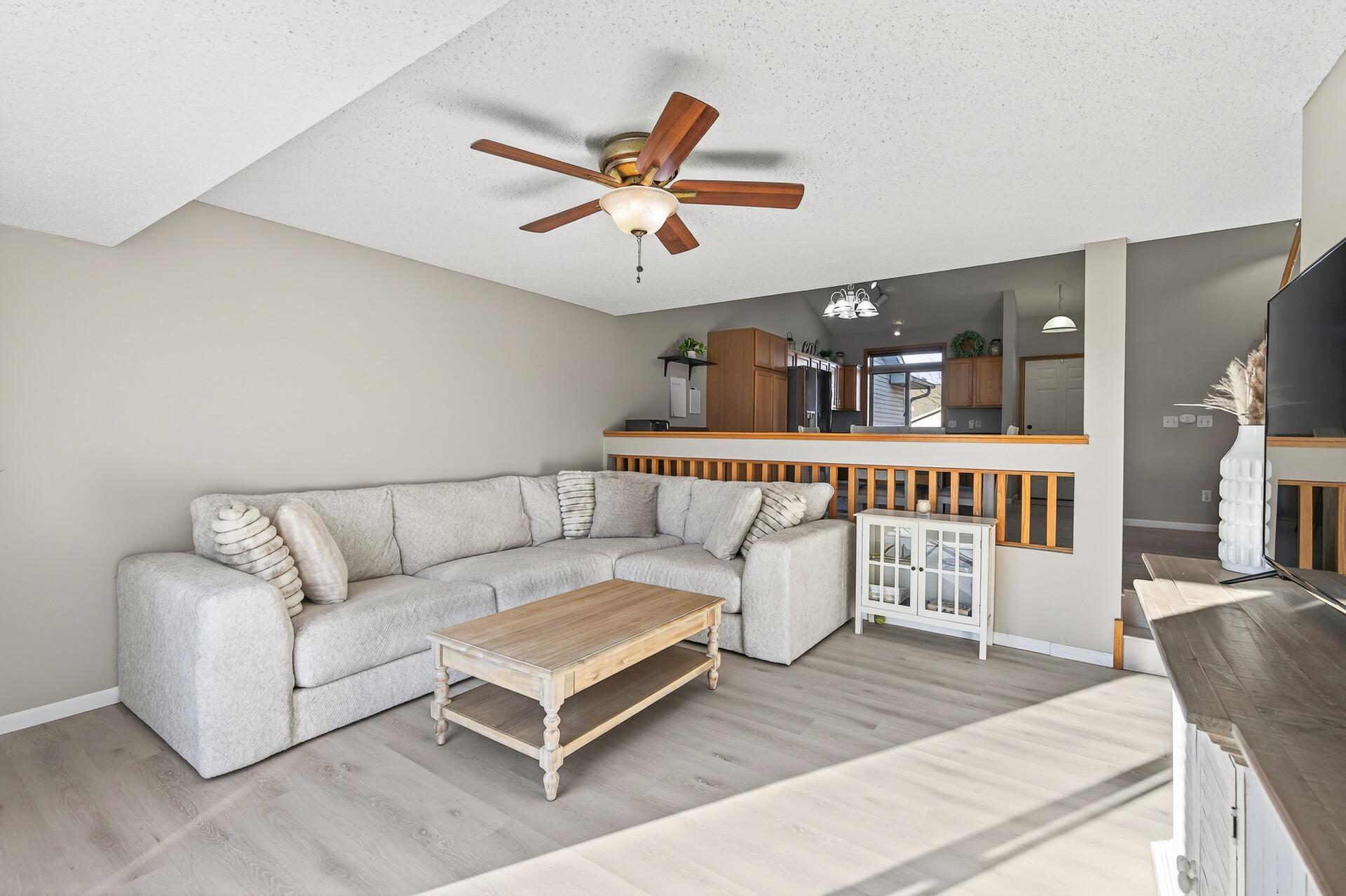 Inviting living space with neutral finishes, updated flooring, and a flexible layout for relaxing or entertaining.