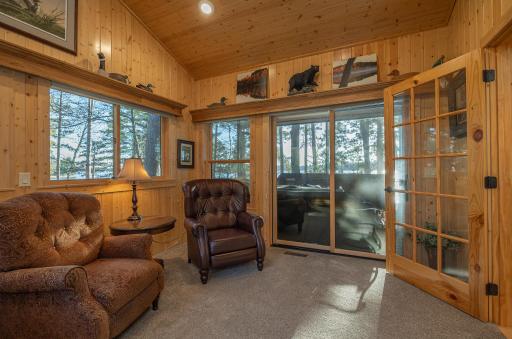 Four season room leads out into the lakeside screen porch