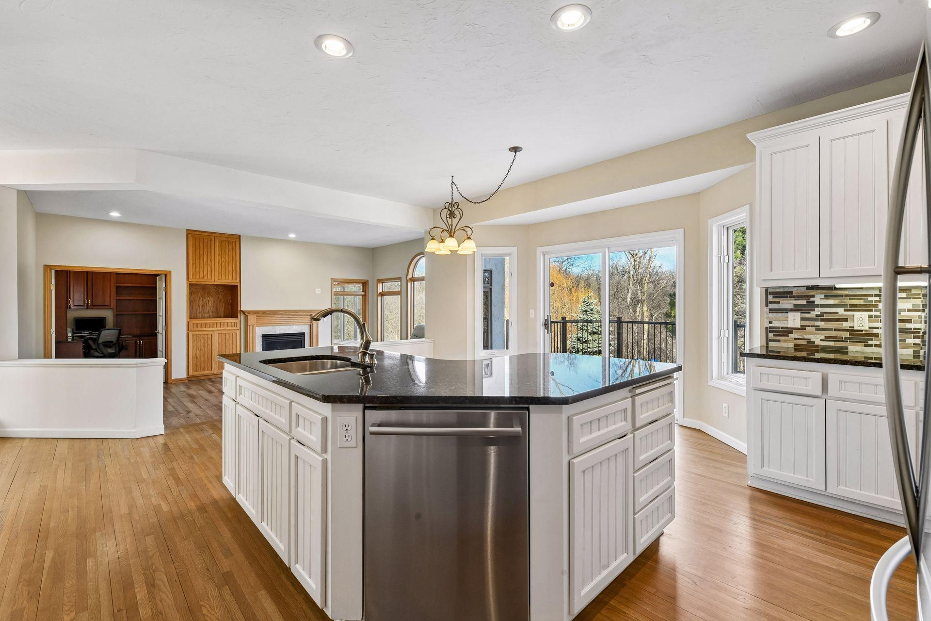 The center island is huge with tons of storage. It also includes a convenient prep sink tied to the home water filtration system!