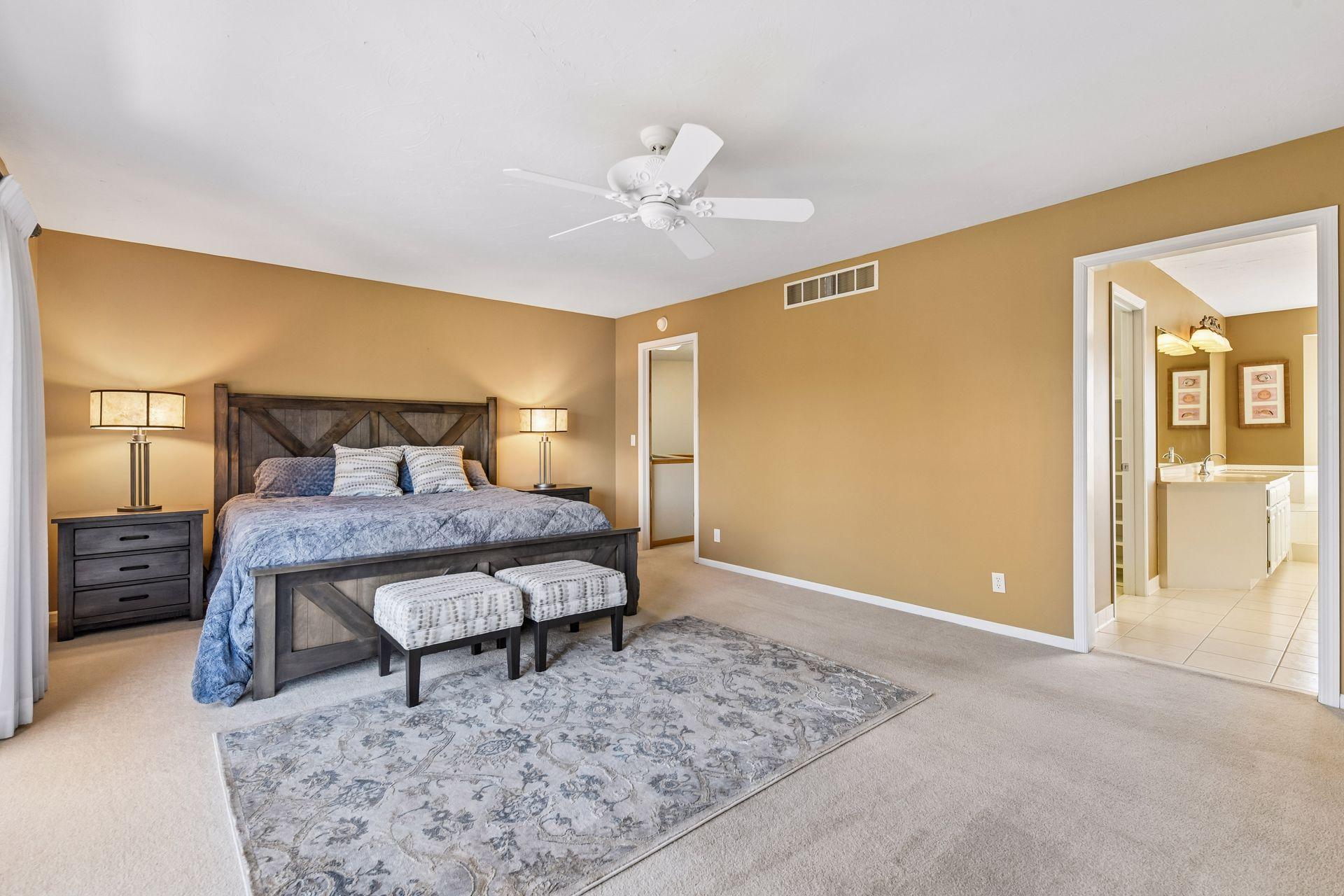 Another view showcasing the huge floor plan, including a large walk-in closet and a private en suite bathroom. The primary retreat offers total comfort and plenty of storage!