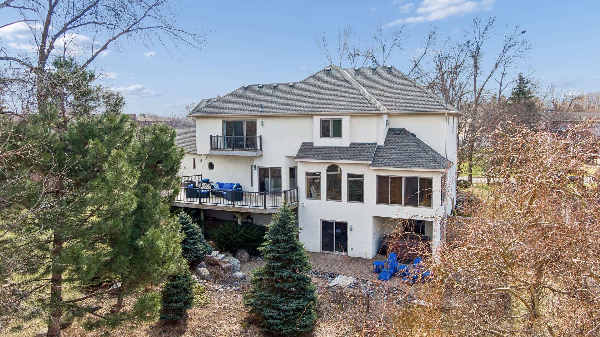 Elevate your outdoor living with a massive deck, primary suite deck, lower-level patio, and sun-drenched porch!