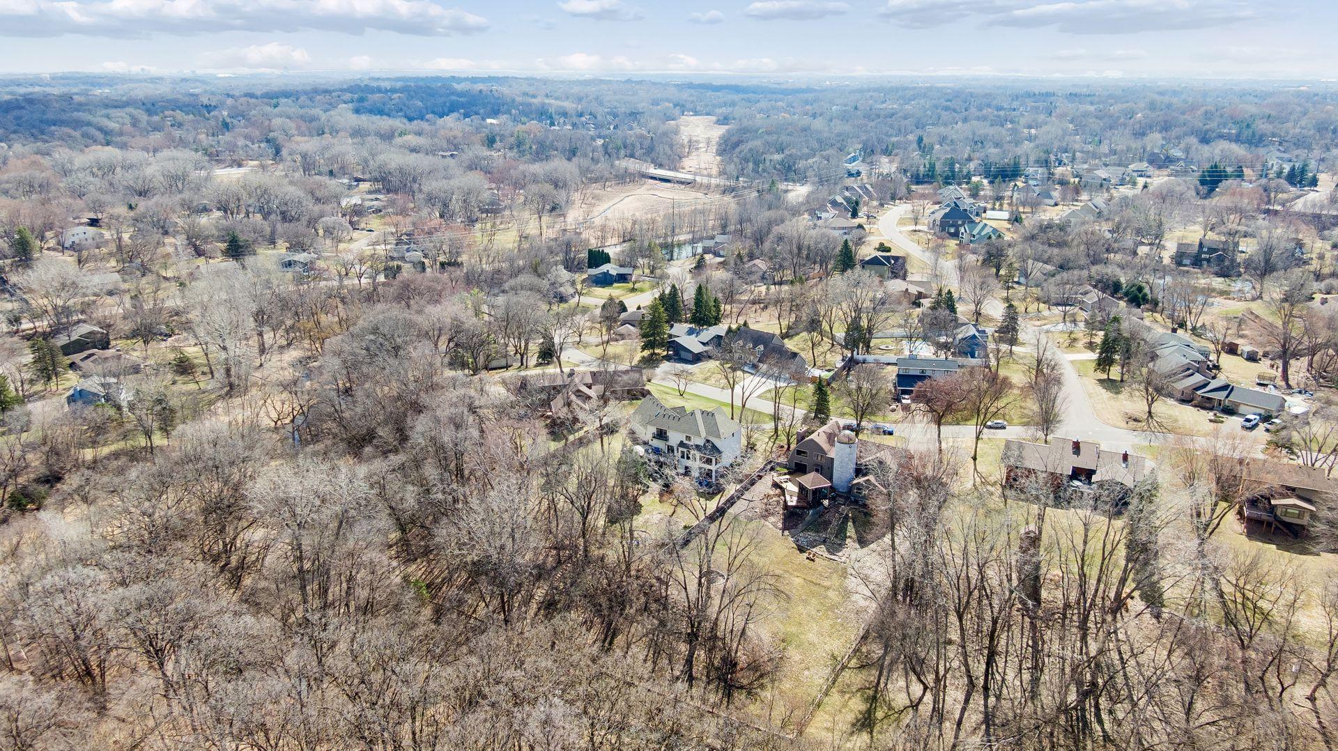 Another amazing aerial view. Bordering Purgatory Creek and the massive 155-acre Purgatory Park Preserve, this 1+ acre retreat offers endless trails and nature at your doorstep.