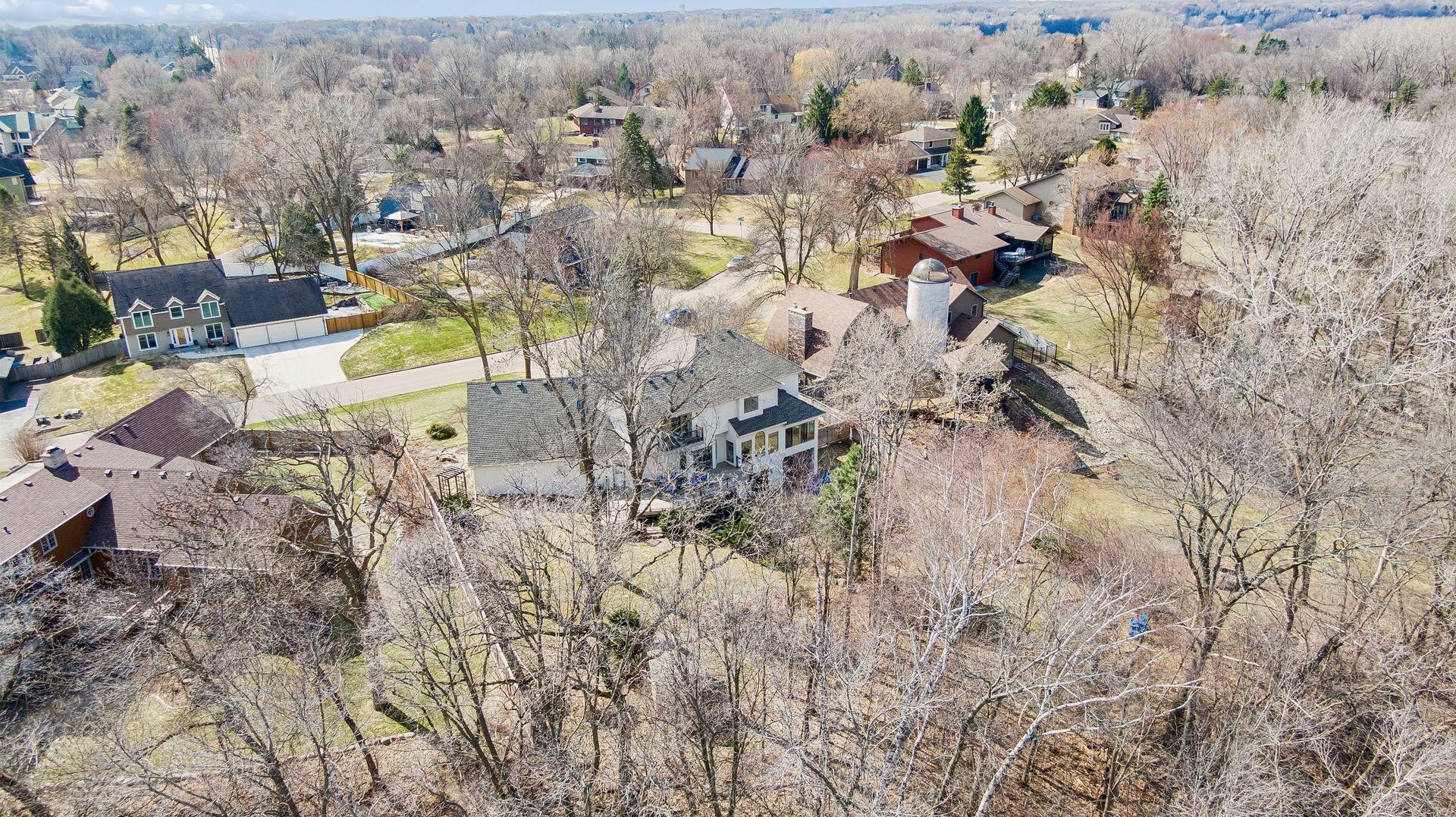 Breathtaking aerial view showcases the mature trees and privacy. A perfect woodland escape in the city.