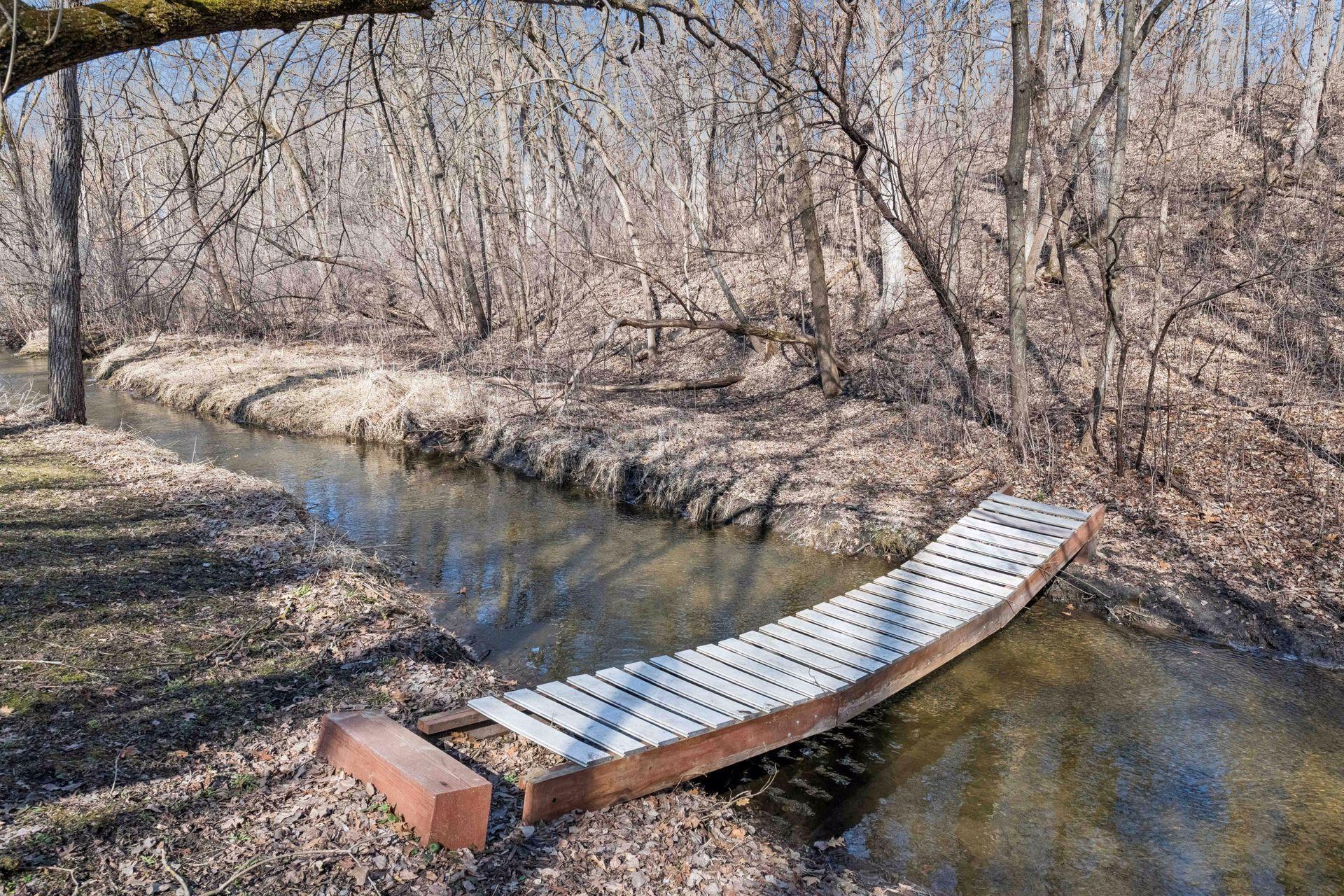 Enjoy your very own bridge over Purgatory Creek. The private path provides a quiet way to explore the woods and enjoy the local landscape in a truly peaceful setting!
