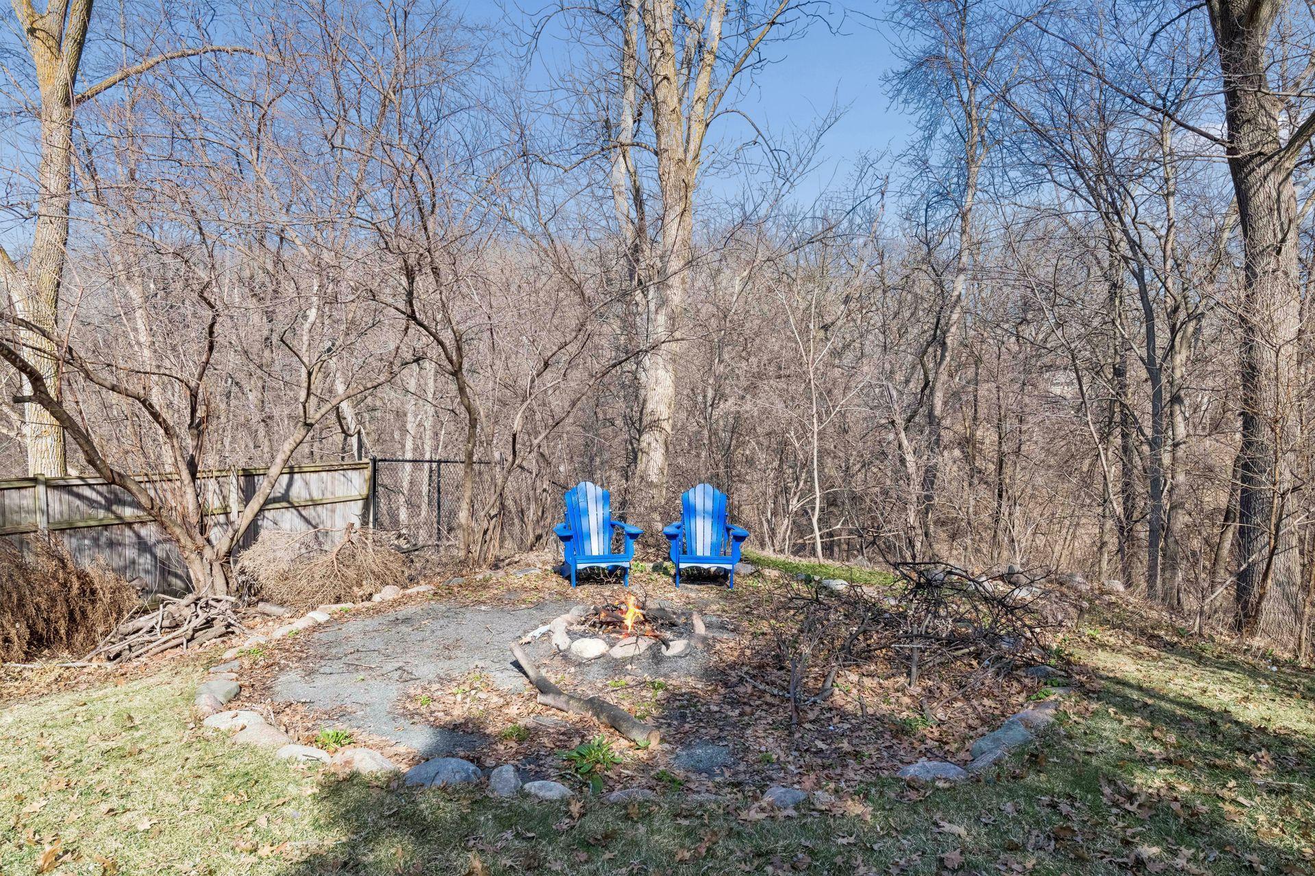 Enjoy a peaceful evening by the rustic fire pit, perfectly nestled at the edge of the woods!